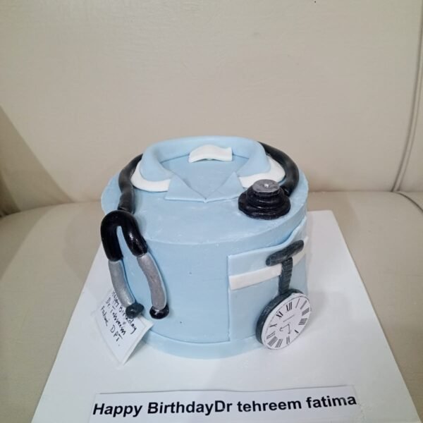 Light blue doctor scrub cake with a fondant stethoscope and personalized birthday nameplate.
