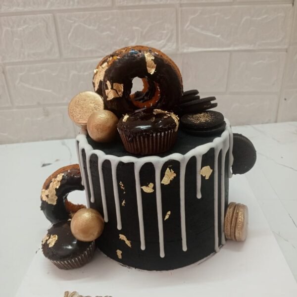 Custom black buttercream birthday cake for Kashaf, featuring white chocolate drip, gold leaf accents, chocolate donuts, macarons, and Oreo cookies.