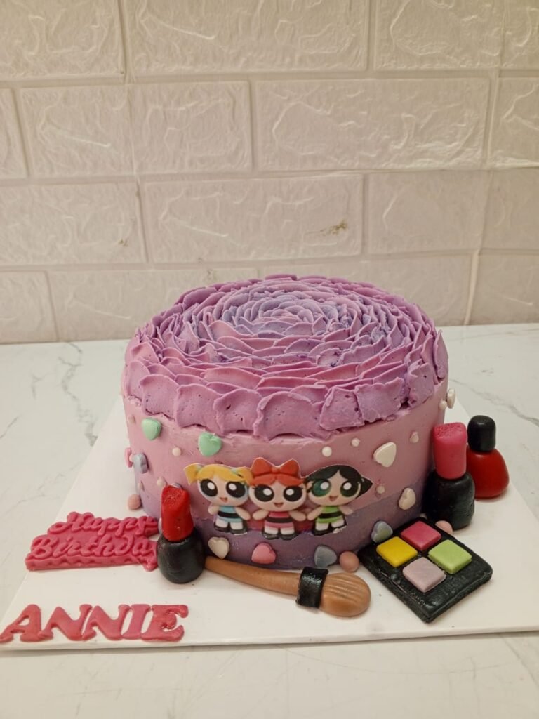 Purple rosette cake with Powerpuff Girls characters and edible fondant makeup accessories like lipstick and eyeshadow.